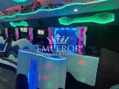 Party Bus Interior Including LED Lights and Walk-In Bar