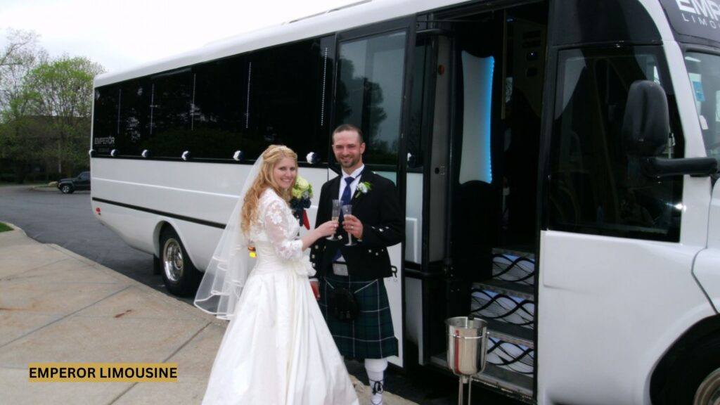 Newlywed couple in front of a luxury limo bus